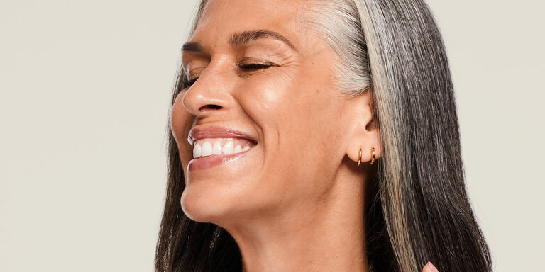 Woman smiling with eyes closed